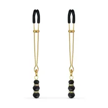 Goldene Brustwarzenklemmen mit schwarzen Perlen Goldene Brustwarzenklemmen mit schwarzen Perlen