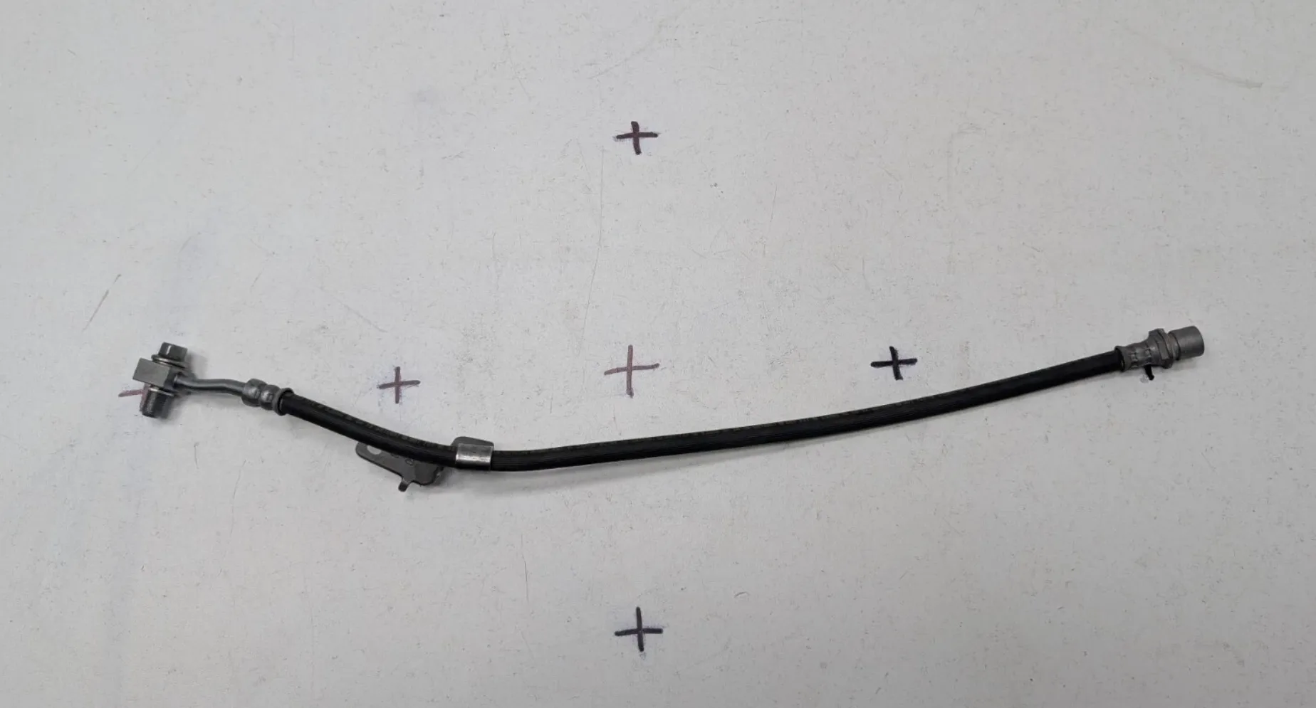 1250731-00-D Гальмівний шланг у зборі – задній – ліва сторона BRAKE HOSE ASSEMBLY – REAR – LEFT HAND