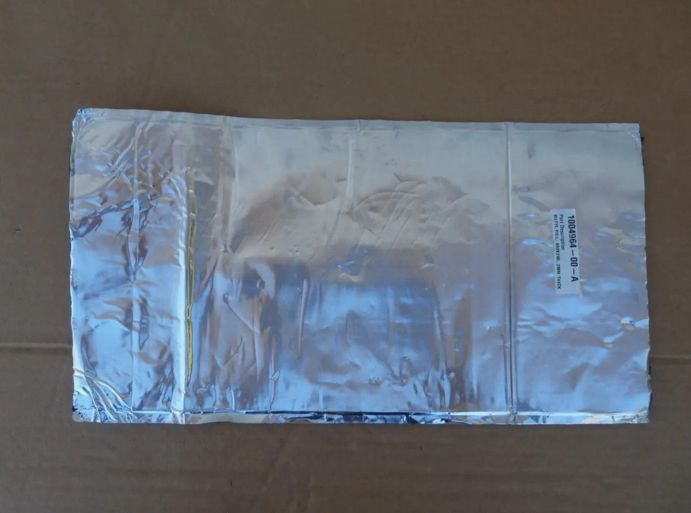 1004964-00-A Заплата з бутилової плівки 480×240×2 мм BUTYL FOIL PATCH