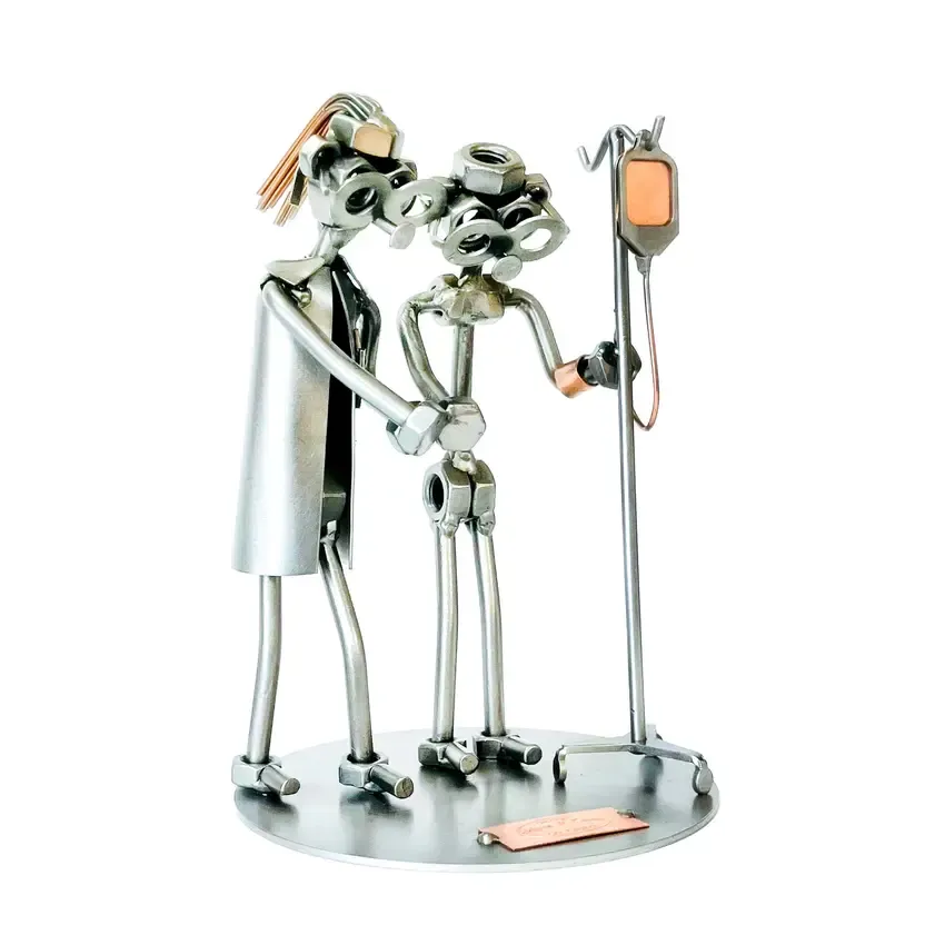 Schraubenmännchen Krankenpflegerin mit Patient Schraubenmännchen Krankenpflegerin mit Patient