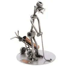 Schraubenmännchen Golfspieler beim Einputten Schraubenmännchen Golfspieler beim Einputten