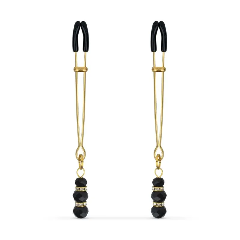 Goldene Brustwarzenklemmen mit schwarzen Perlen Goldene Brustwarzenklemmen mit schwarzen Perlen