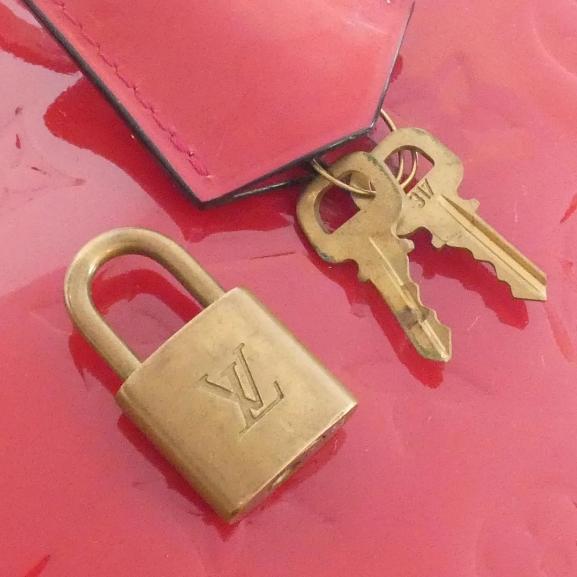 LOUIS VUITTON Gold Alma Bag