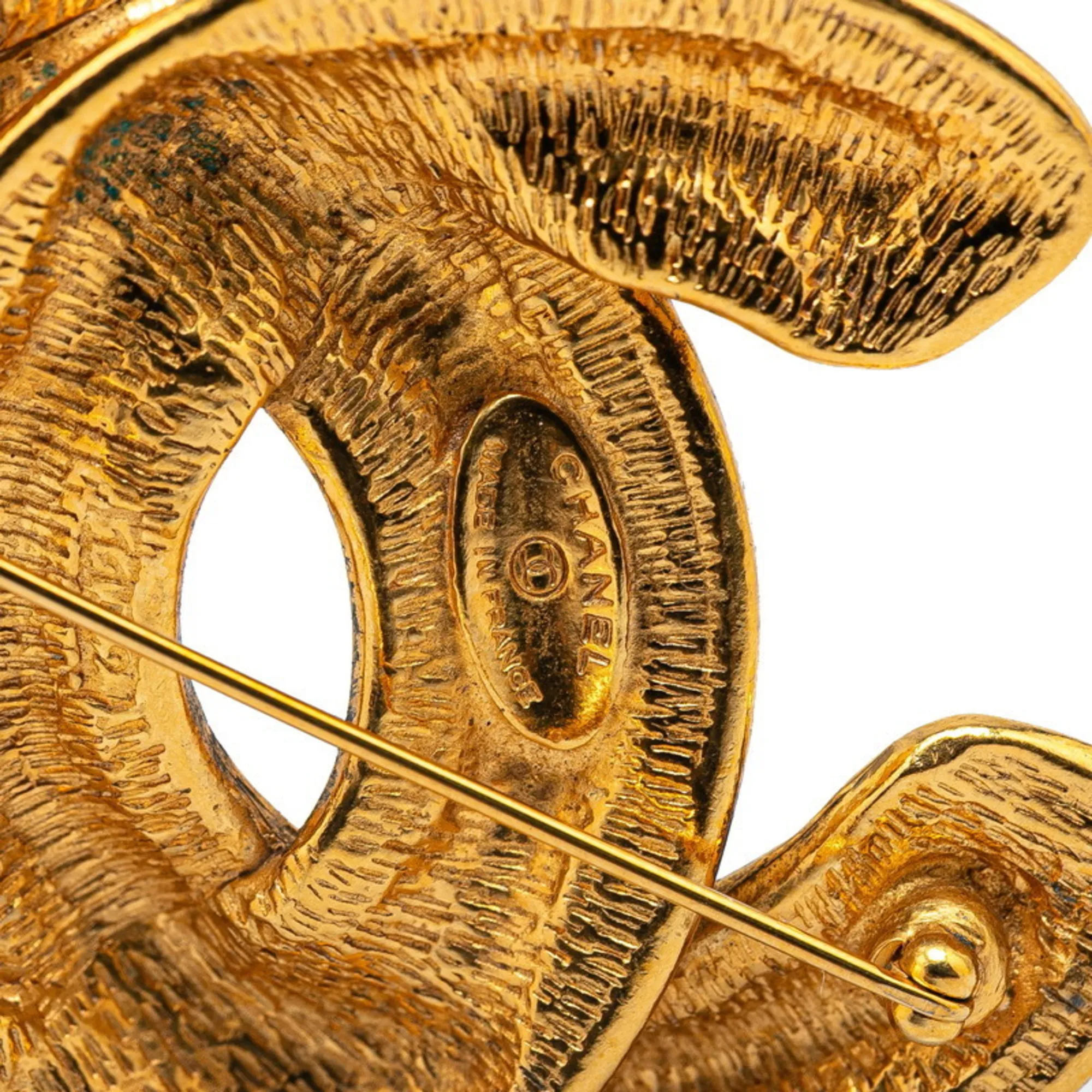 CHANEL Gold Logo Brooch