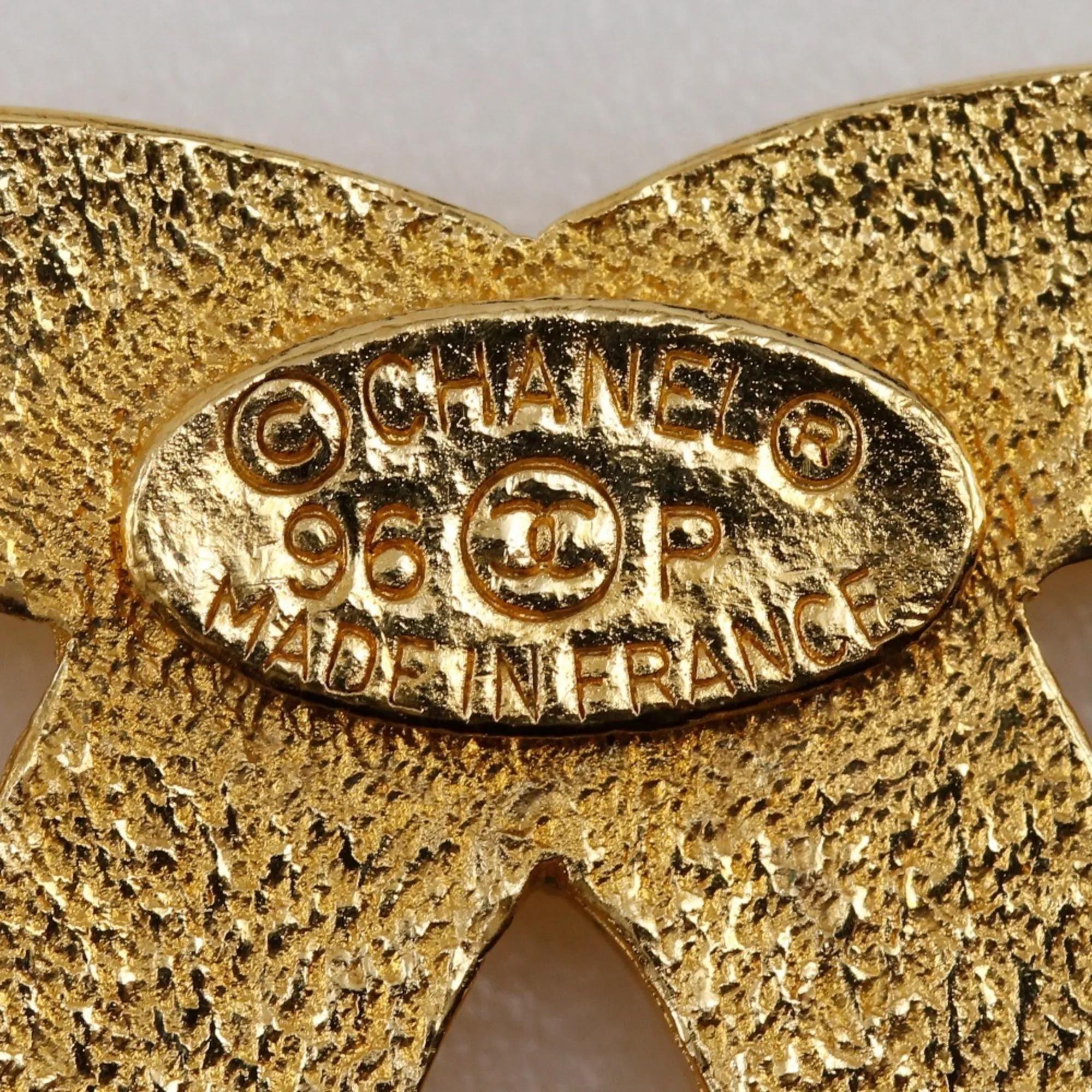 CHANEL Gold Logo Brooch