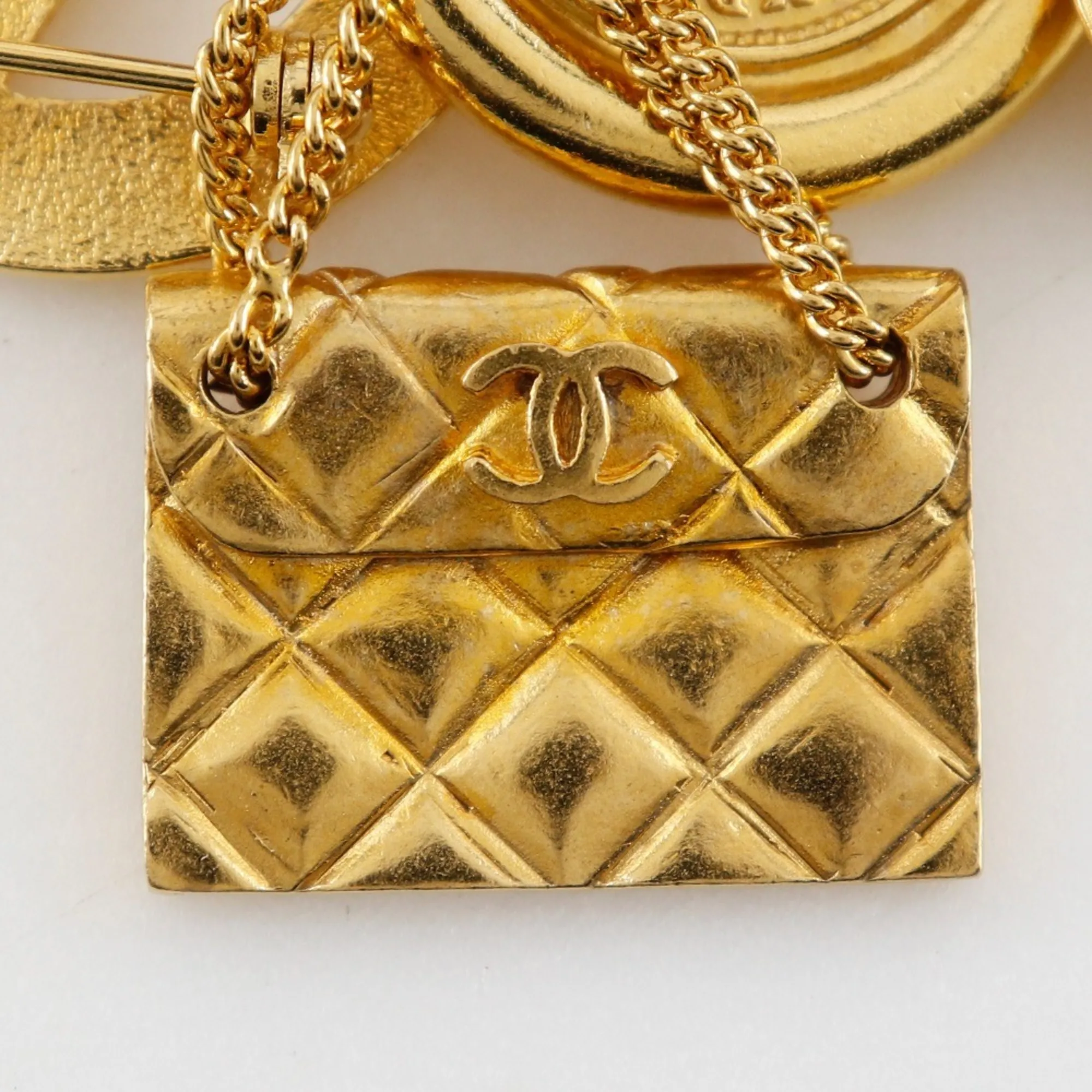 CHANEL Gold Logo Brooch
